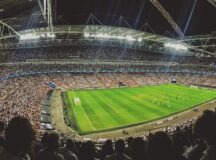 a large soccer field surrounded by fans in the stands